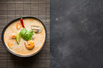 Tom yam kung spicy thai soup with shrimp, seafood, coconut milk and chili pepper. Copy space