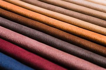 Close-up diagonal lines of textile upholstery in samples to select the color and fabric of the...