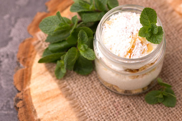 Obraz na płótnie Canvas Coconut bisquit dessert with ricotta, mint. Yogurt breakfast