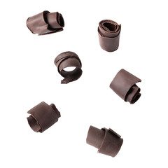 Set of flying chocolate curls on white background