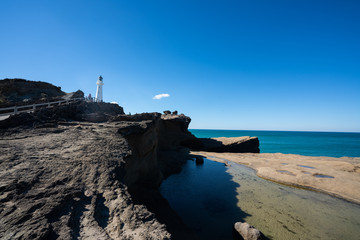 Castlepoint Lighthouse in the Wairarapa, New Zealand on a clear sunny day