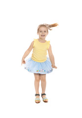 Pretty little girl jumping against white background