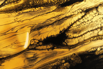 Beautiful abstract drawing made with gold paint as background