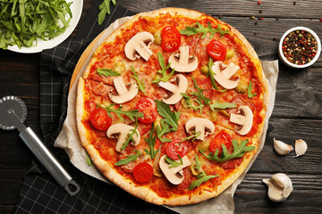 Flat lay composition with delicious pizza baked in oven