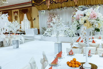 hall for a wedding celebration decorated in light colors of the winter fairy tale