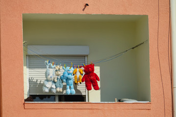 CLOSE UP: Cute stuffed animals are hung out to dry on balcony after being washed