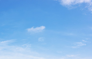 Blue sky background and white clouds soft focus, and copy space