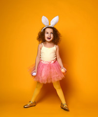 Cute little child girl wearing bunny ears on Easter day.