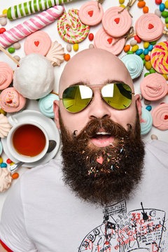 Happy Bearded Man Biting Cream Cake Isolated On White Background