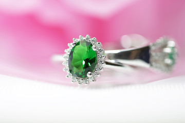 Emerald green gemstone ring.Focus on green gemstones.