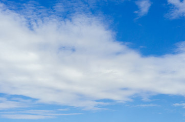 white clouds on a background of blue summer sky