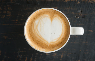 Heart Shape Froth Milk Latte Art in White Coffee Cup on Black Wood Table 2