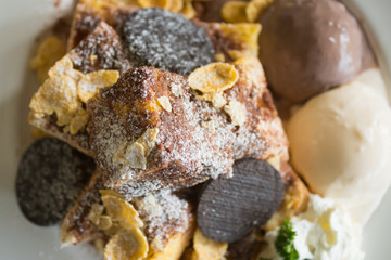 Toast Bread or Dessert and Oreo Cookies Ice Cream Cornflakes Whipped Cream Chocolate Powder Flatlay Closeup