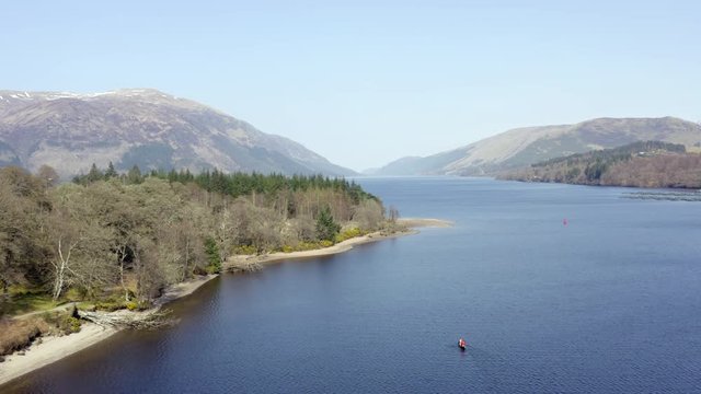 Canoeists in Scotland in a Loch Surrounded by Beautiful Landscape From the Air
