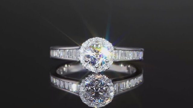Diamond ring on a black background close-up.