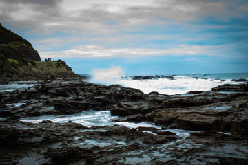 Fototapeta na wymiar Sea Spray Over Rocks