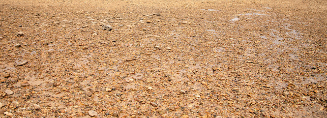  Coast, river bank,Sandy texture,Large sand with small stones, bright sunlight.  summer, beach.Morning sunrise at the pier Railay Bay, railay Beach railay Amphur Muang, Krabi Thailand