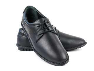 A pair of classic black leather men's shoes isolated on white background.