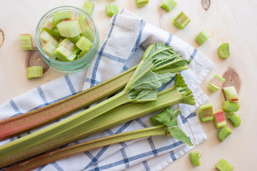rhubarb stalks on a wooden chopping board