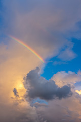 Fototapeta na wymiar rainbow in the sky clouds