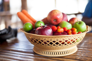 Fresh fruits and vegetables on wooden table.