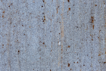 old metal surface with rust spots, blue background