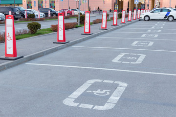red signs Parking for the disabled at the mall. life of a disabled person in the city