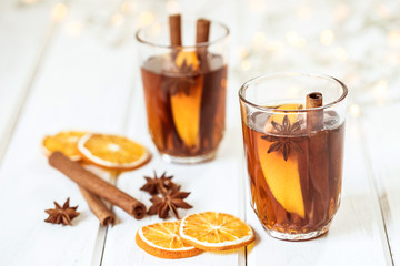 Mulled wine on white table in night celebration of  New Year party and delicious Christmas drink