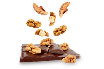dark chocolate bar with walnuts on a white background