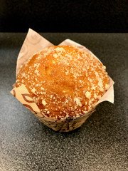 Freshly Baked Muffin Ready to Eat on Dark Surface.