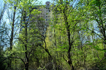 Fototapeta premium The coat of arms of the Soviet Union is seen on a building in the abandoned city of Prypiat, near the Chernobyl nuclear power plant, in Ukraine. April 2019