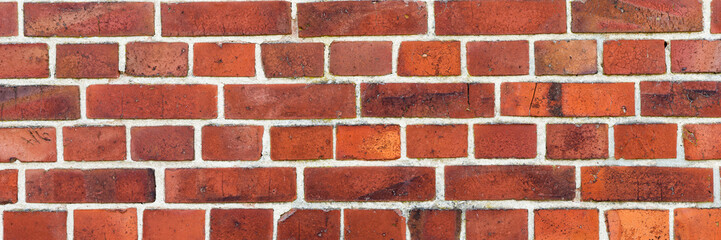 Obraz premium Panoramic image of red brick wall. Texture of red brick wall. Background of red brick wall