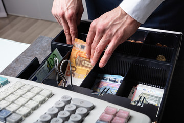 Euro Banknotes And Coins In Cash Box