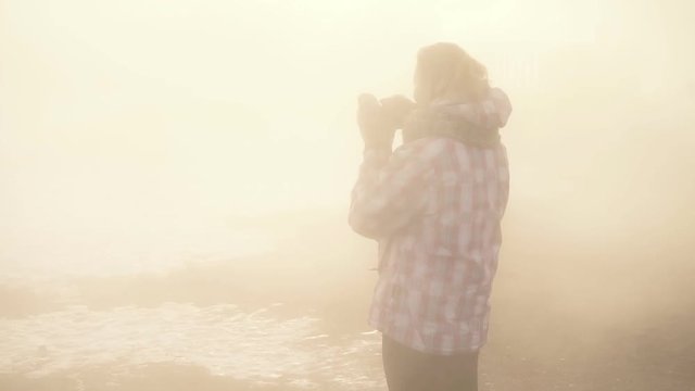 Photographer on the mistery fog make a photo