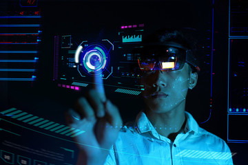 Business man try vr glasses hololens in the dark room | Portrait of young asian boy experience ar communication | Future technology concept