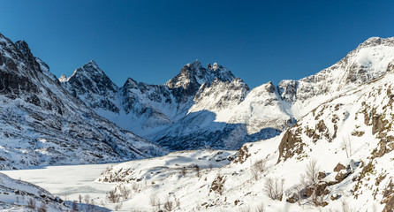 Panorama of snow covered mountains in Norway, Lofoten Islands