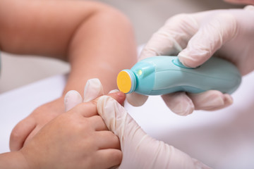 Mother Cutting Her Baby Finger Nail