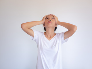 Woman having headache on white background