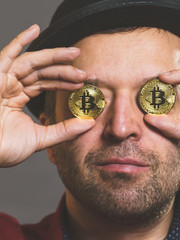 Man having bitcoin in eye