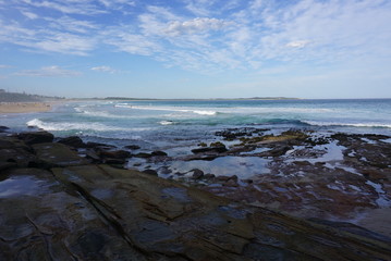 rocks by the ocean at Cronulla beach in sydney
