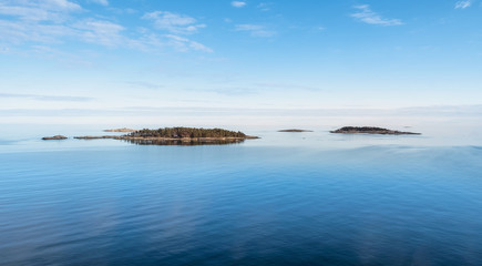 Beautiful sea landscape with island and nice evening light at summer day in archipelago Gulf of...