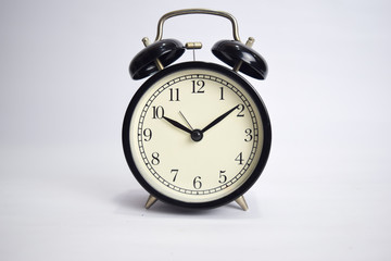 Clock ticking to 10 o'clock isolated on white background