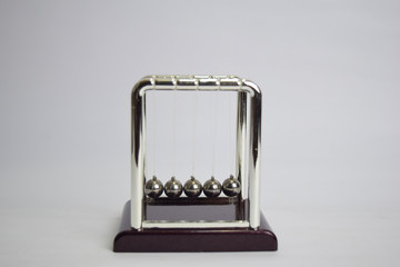 Newton's cradle work. Education, science and physics concept isolated white background