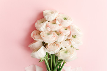 Bouquet of pink ranunculus flower close up. Flat lay, top view. Ranunculus flower texture.