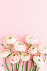 Pastel pink ranunculus flowers bouquet on pink background. Minimal floral concept. Flat lay, top view.