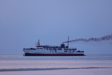 Obraz premium Ferry with smoke coming from stack ,Diesel engine ready to leaving from the harbor