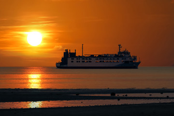 Fototapeta premium The ferry sailing at sea episode sunset