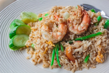 Fried rice with shrimp on the white dish.