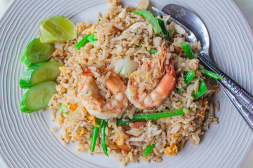 Fried rice with shrimp on the white dish.