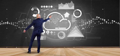 Businessman in front of a wall with Cloud and wifi concept with icon, stats and data 3d rendering